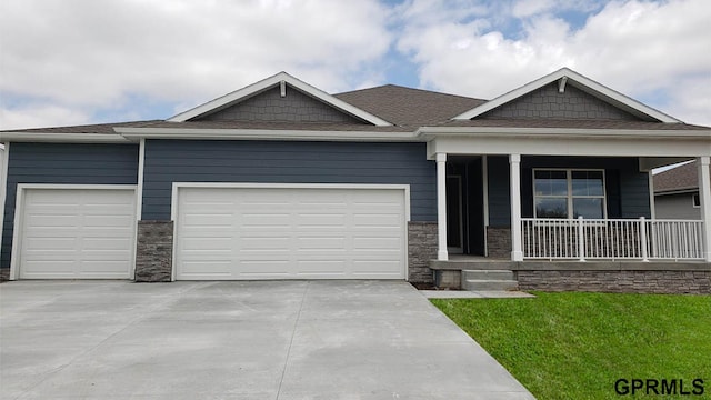 view of front of house with a porch and a garage