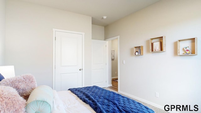 bedroom with hardwood / wood-style flooring