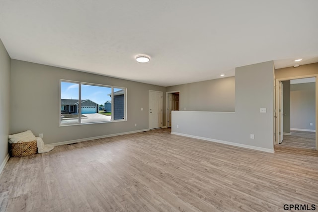 spare room featuring light hardwood / wood-style floors