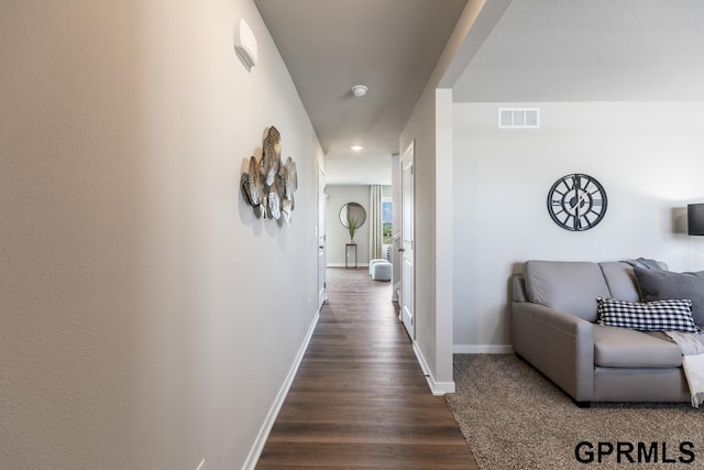 hallway with dark hardwood / wood-style floors