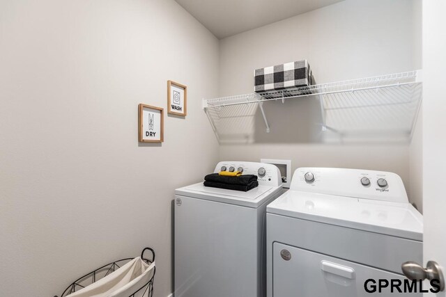 washroom featuring independent washer and dryer