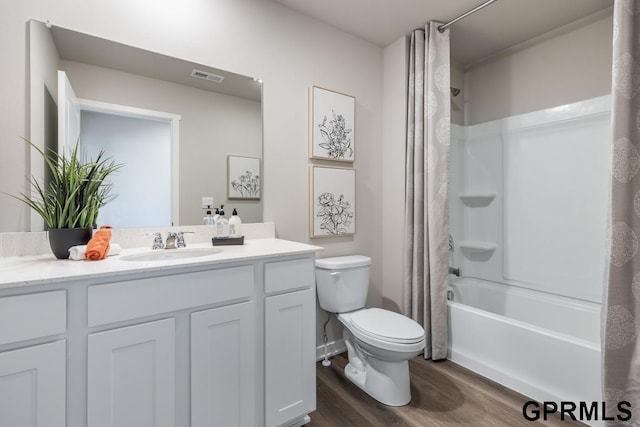 full bathroom featuring shower / bathtub combination with curtain, wood-type flooring, vanity, and toilet