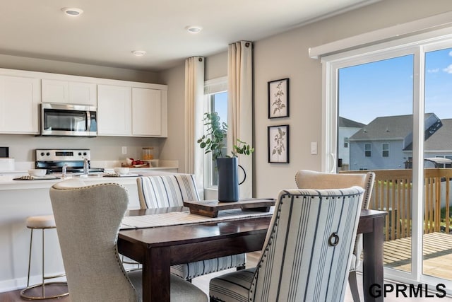 dining area with hardwood / wood-style floors