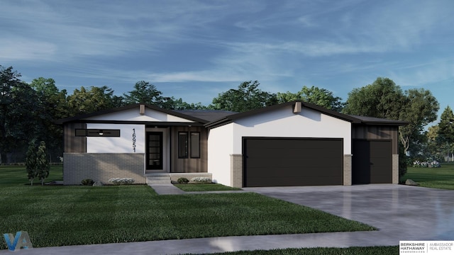 view of front of property featuring a garage and a front lawn