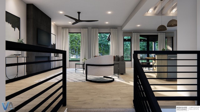 interior space featuring ceiling fan and light hardwood / wood-style flooring