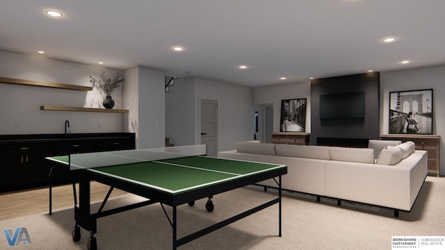 recreation room featuring light hardwood / wood-style floors and sink