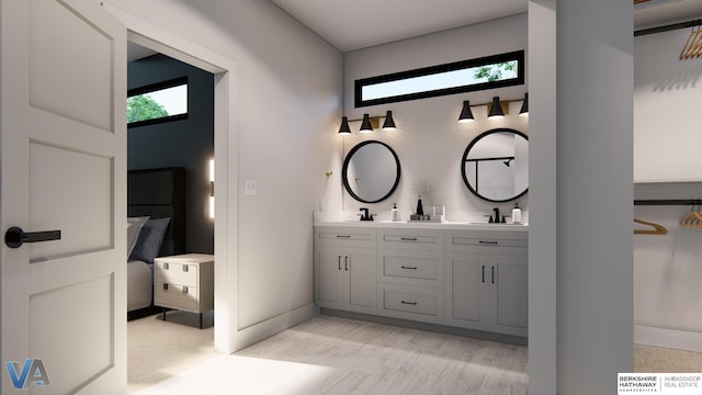 bathroom with hardwood / wood-style floors and vanity