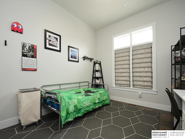 bedroom featuring dark wood-type flooring