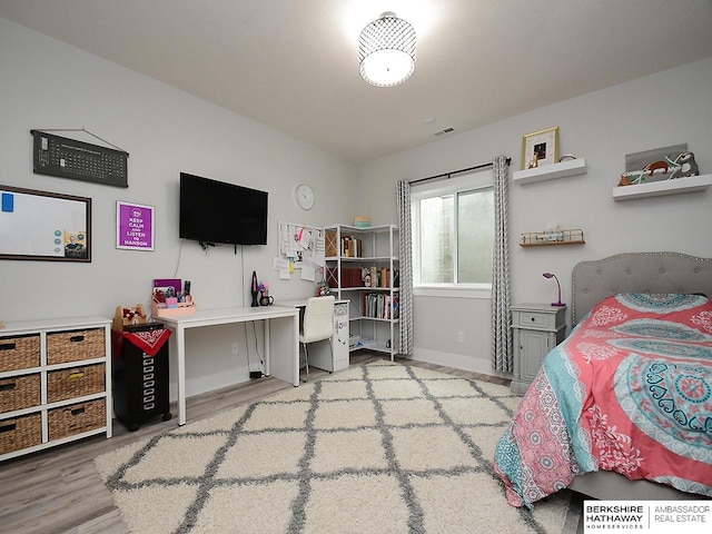 bedroom featuring hardwood / wood-style flooring