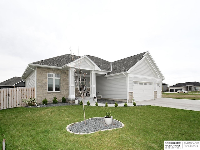 ranch-style home with a front yard and a garage