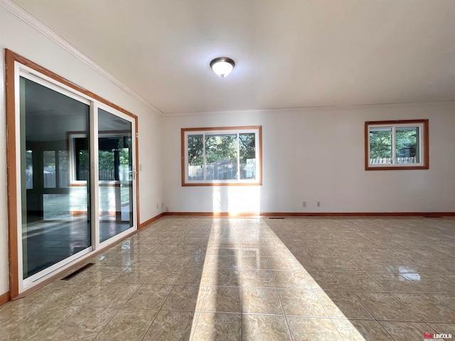 spare room with crown molding