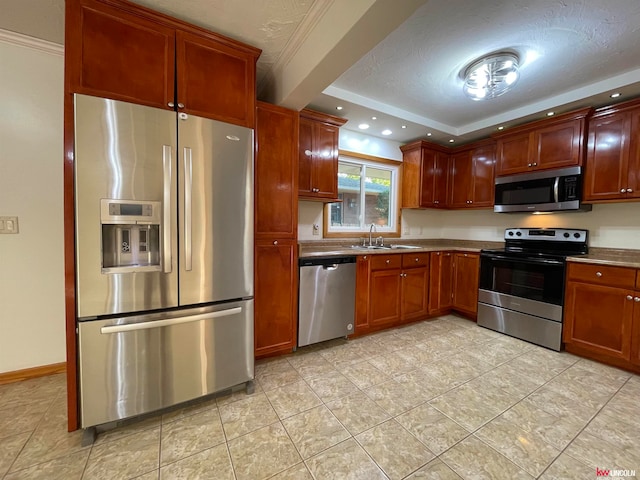 kitchen with stainless steel appliances, a textured ceiling, light tile patterned floors, and sink