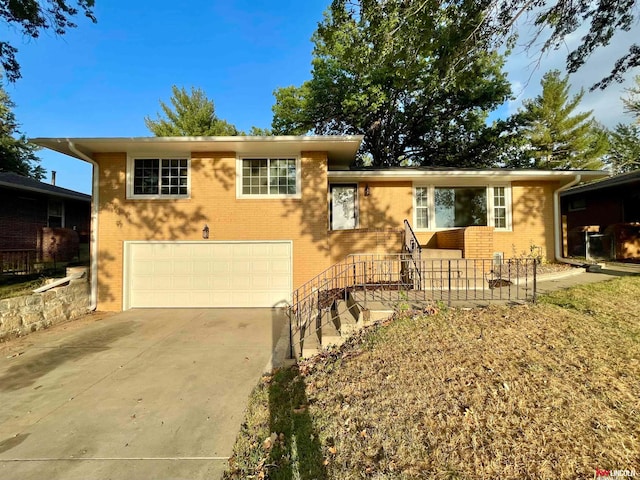 split level home featuring a garage