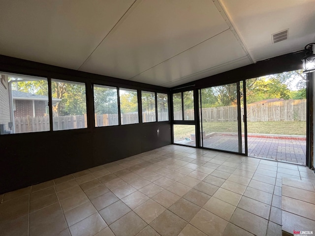 unfurnished sunroom featuring a healthy amount of sunlight