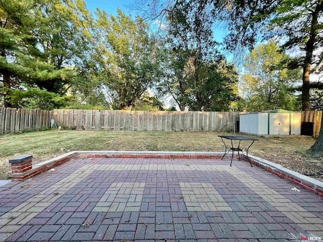 view of patio with a storage unit