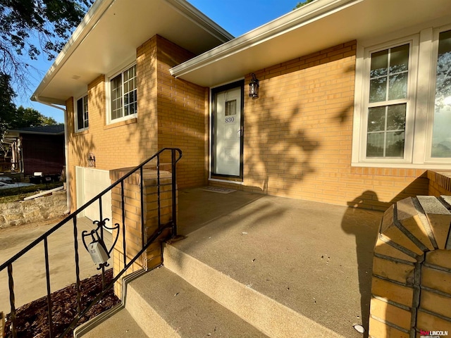 doorway to property with a patio