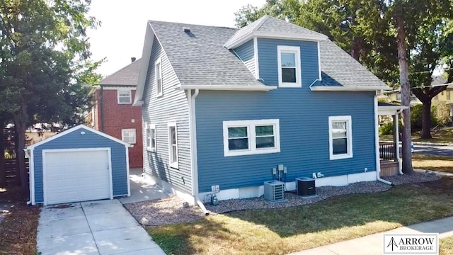 exterior space with a yard, an outdoor structure, and a garage