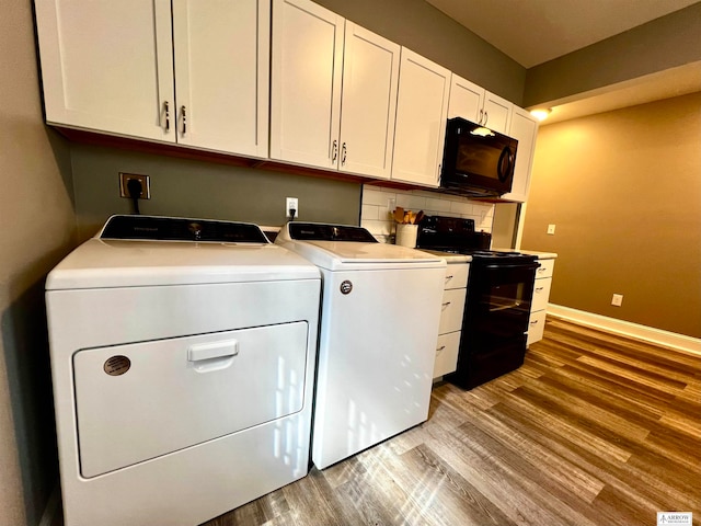 laundry area featuring hardwood / wood-style floors and independent washer and dryer