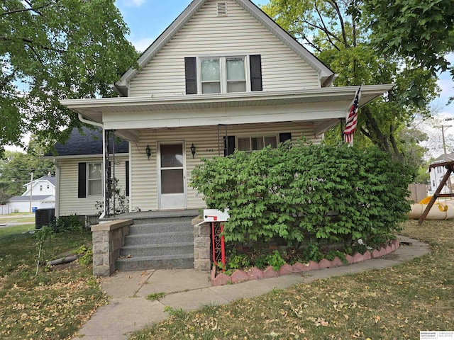 bungalow with central AC and a porch