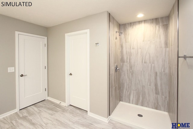 bathroom with tiled shower