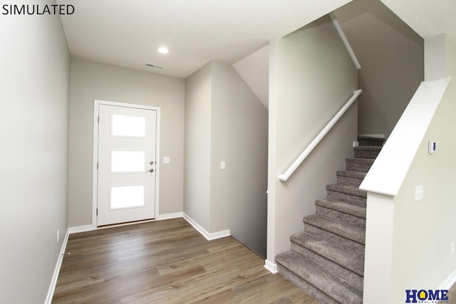 entryway with wood-type flooring