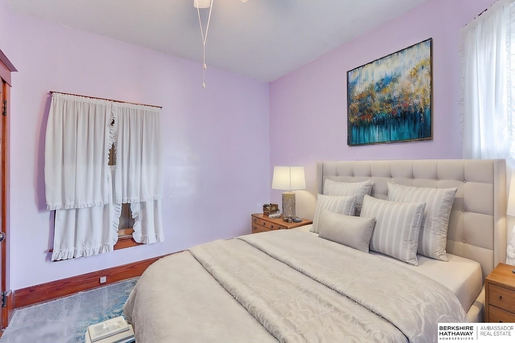 bedroom with hardwood / wood-style flooring