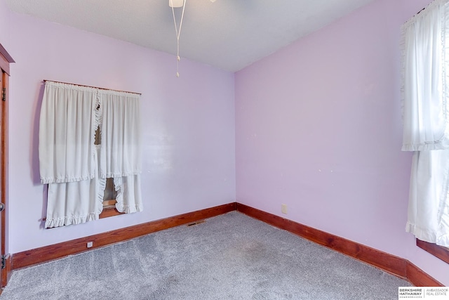 unfurnished room featuring carpet flooring