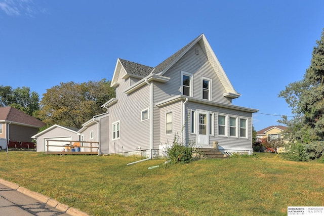 view of side of home featuring a lawn and a garage