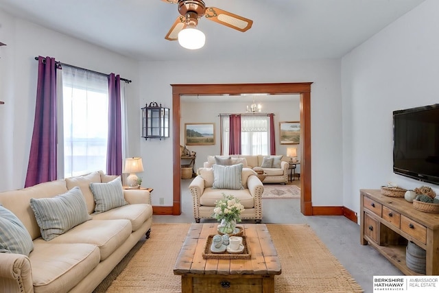 carpeted living room featuring a healthy amount of sunlight and ceiling fan