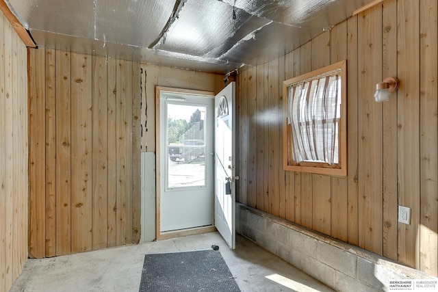 doorway with wooden walls