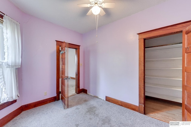 unfurnished bedroom featuring ceiling fan and light colored carpet