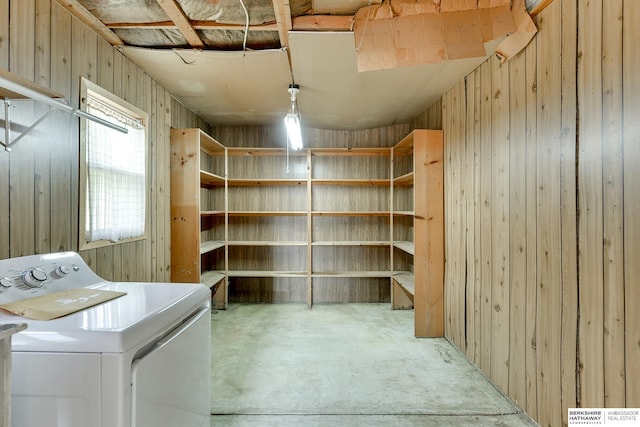 washroom featuring washer / clothes dryer and wooden walls