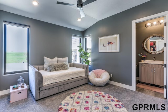 interior space featuring lofted ceiling, ceiling fan, and sink