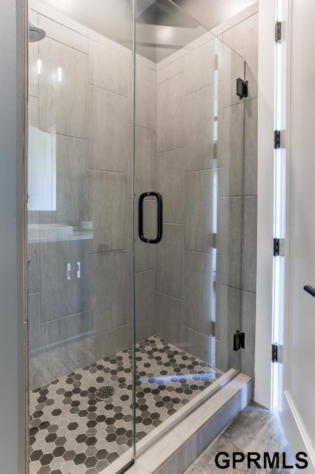 bathroom with an enclosed shower