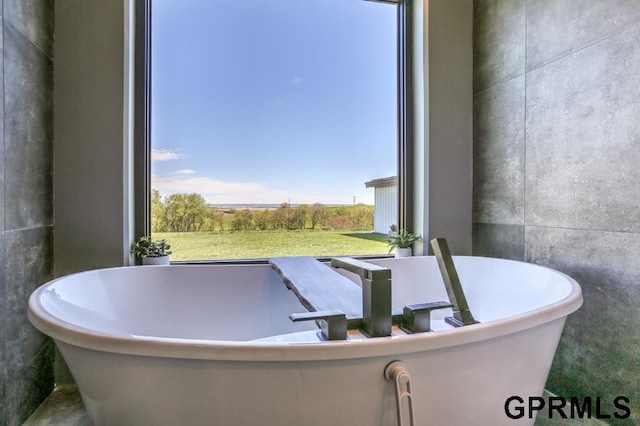 bathroom featuring a bath