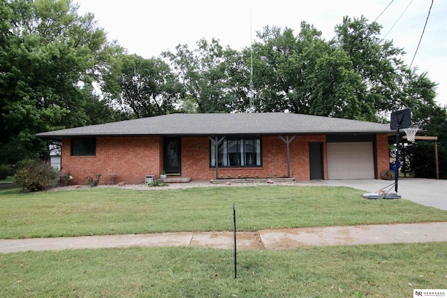 ranch-style home featuring a front lawn and a garage