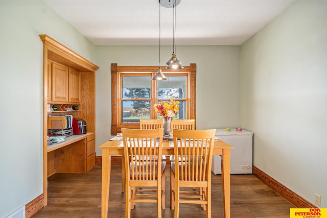 dining room featuring dark wood-type flooring