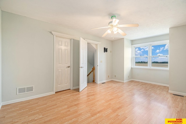 unfurnished bedroom featuring light hardwood / wood-style floors and ceiling fan