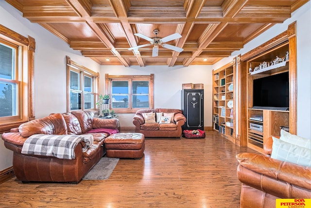 living room with beam ceiling, coffered ceiling, hardwood / wood-style floors, and ceiling fan