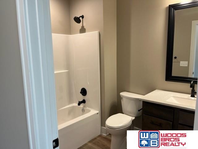 1127 Asher Ave, Hickman, NE 68372 - full bath featuring vanity, shower / washtub combination, and wood finished floors