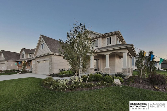 view of front of home with a garage, a porch, and a front yard