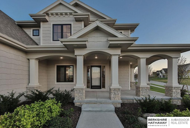 property entrance featuring a porch