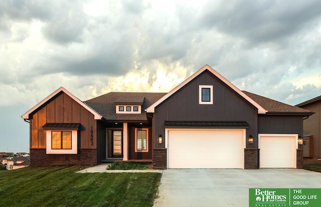 view of front of home with a garage and a front lawn