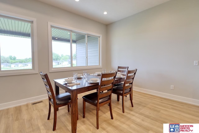 dining space featuring light hardwood / wood-style floors and plenty of natural light