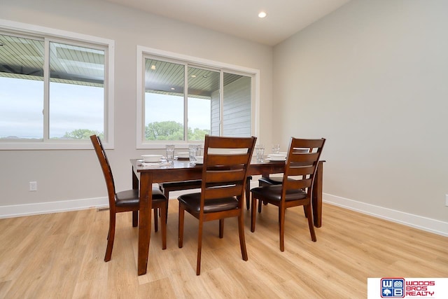 dining space with light hardwood / wood-style floors