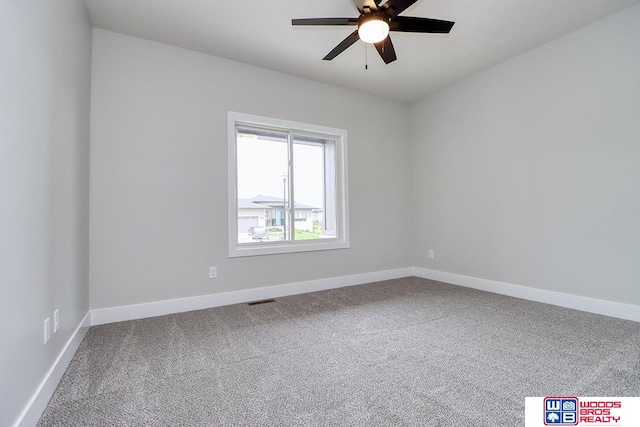 carpeted empty room featuring ceiling fan