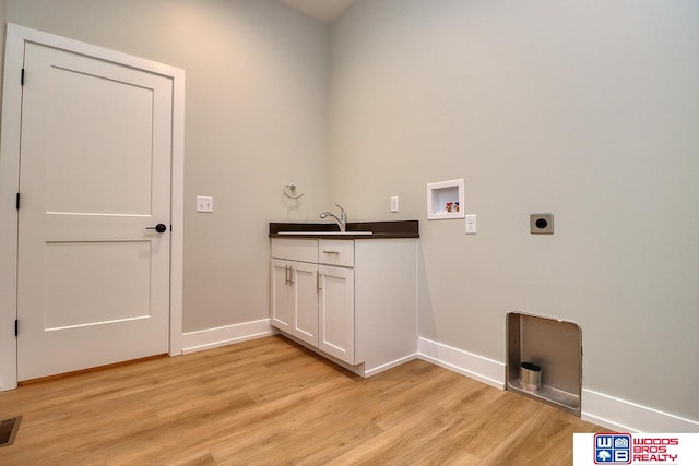 laundry room with light hardwood / wood-style floors, electric dryer hookup, and hookup for a washing machine