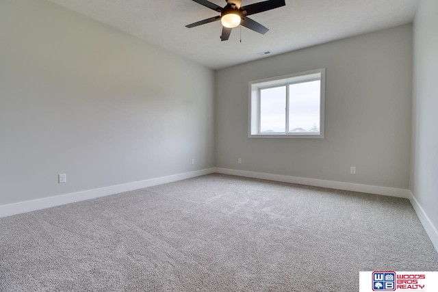 unfurnished room with ceiling fan and carpet floors