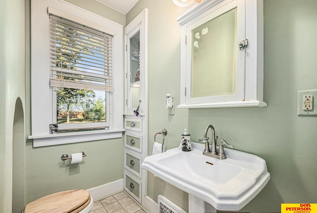 bathroom featuring toilet and sink