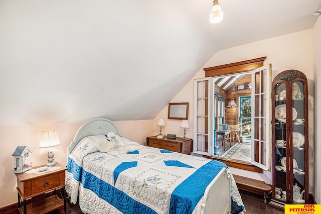 bedroom with lofted ceiling, access to exterior, and dark hardwood / wood-style flooring